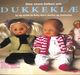 Omslagsbilde:Den store boken om dukkeklær : sy og strikk til Baby Born, Barbie og Dukkelise